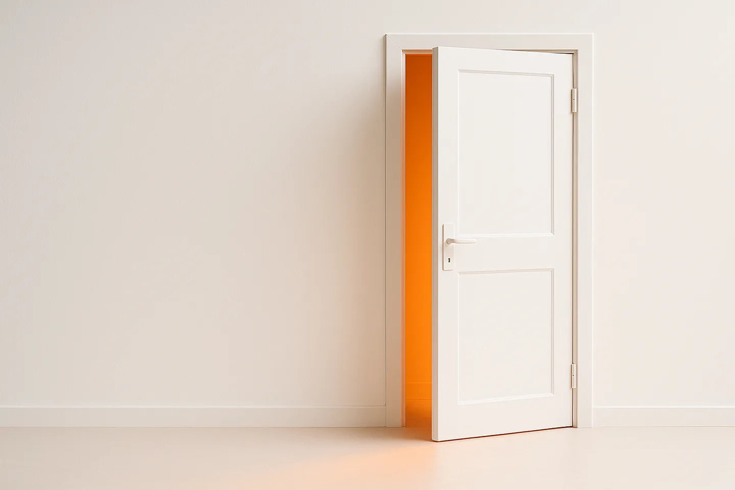 A white door, slightly open, with warm orange light spilling out through the gap onto a white floor