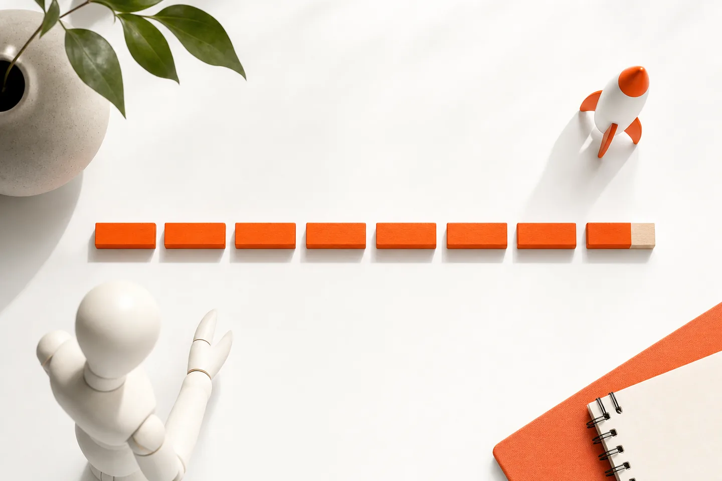 A row of short orange blocks of equal length on white paper, each one exactly the same size